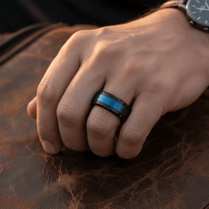 BLIZZARD — Lifestyle photo on hand — men's tungsten wedding ring.
