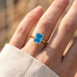Blue Radiant lab-grown diamond solitaire engagement ring, Yellow Gold, lifestyle photograph
