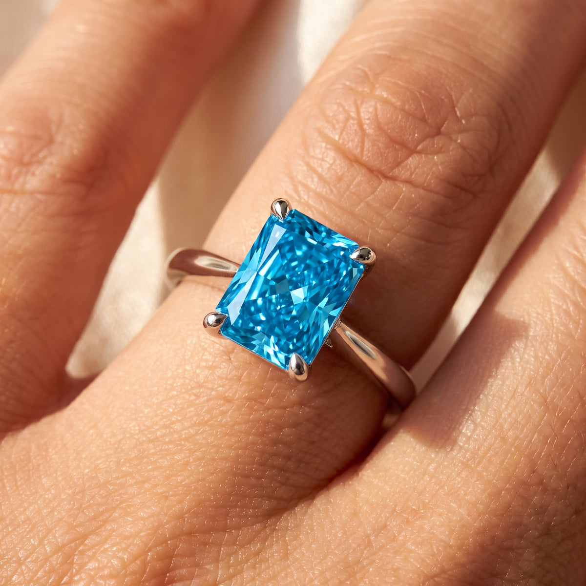 Blue Radiant lab-grown diamond solitaire engagement ring, 925 Sterling Silver, on-finger close-up