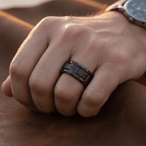 BRICKADE — Lifestyle photo on hand — men's tungsten wedding ring.