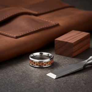 BUZZARD — Editorial masculine still life — men's tungsten wedding ring.