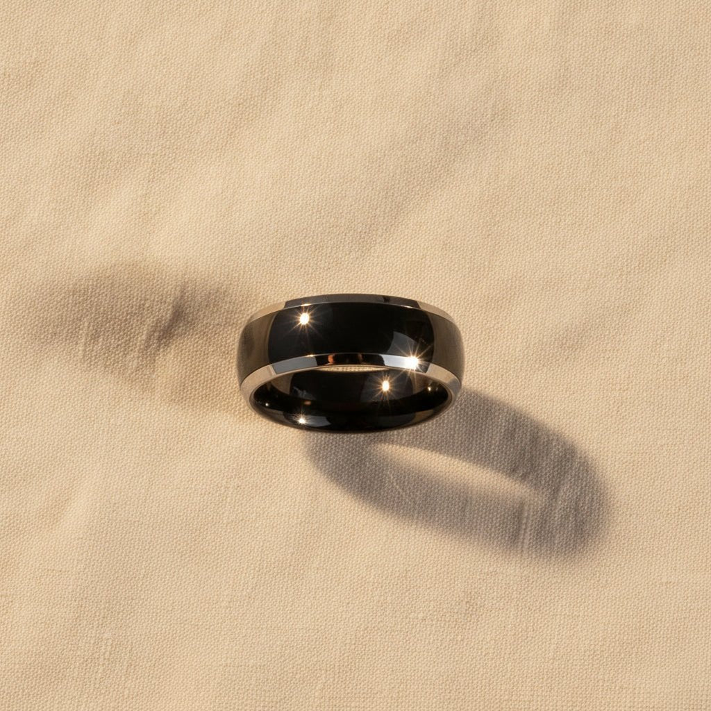 CARRERA black ceramic ring macro detail overhead flat lay, polished silver beveled edges