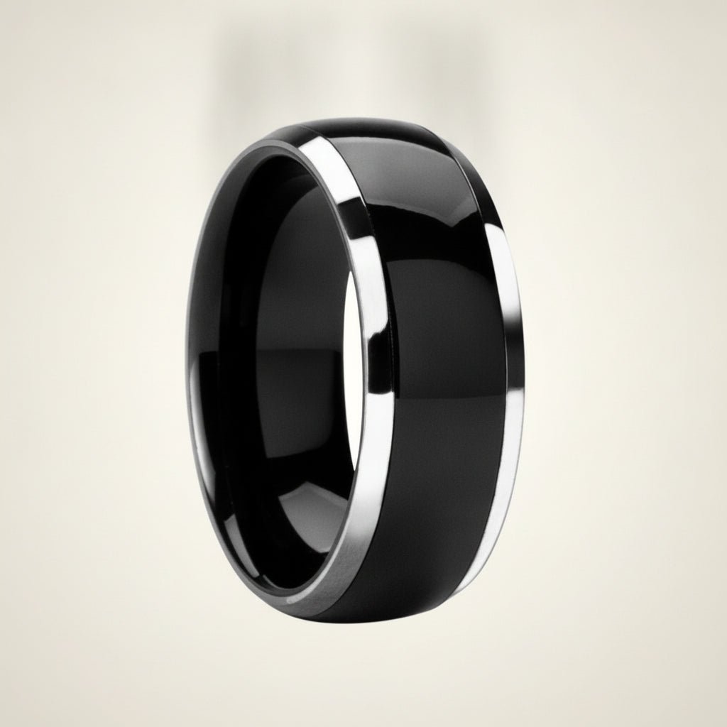 CARRERA black ceramic men's wedding band with polished silver beveled edges, studio hero shot