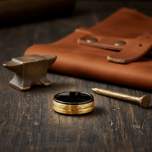 CENTAUR — Editorial masculine still life — men's tungsten wedding ring.