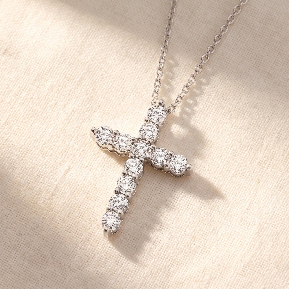 Classic Diamond Cross Pendant 925 silver lab grown diamond pendant styled flat lay on cream linen