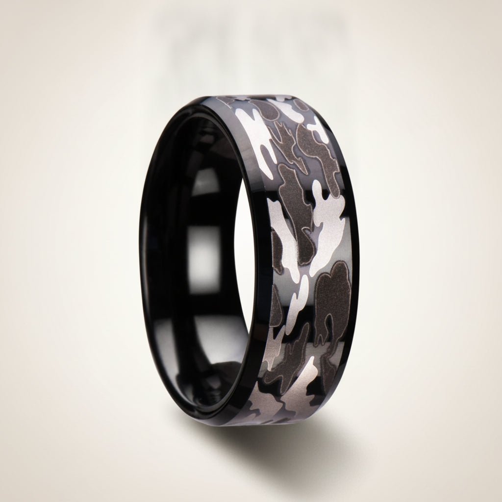 CONQUEST beveled black tungsten carbide wedding band with black and gray camouflage pattern inlay running around the band and polished edges, studio hero shot