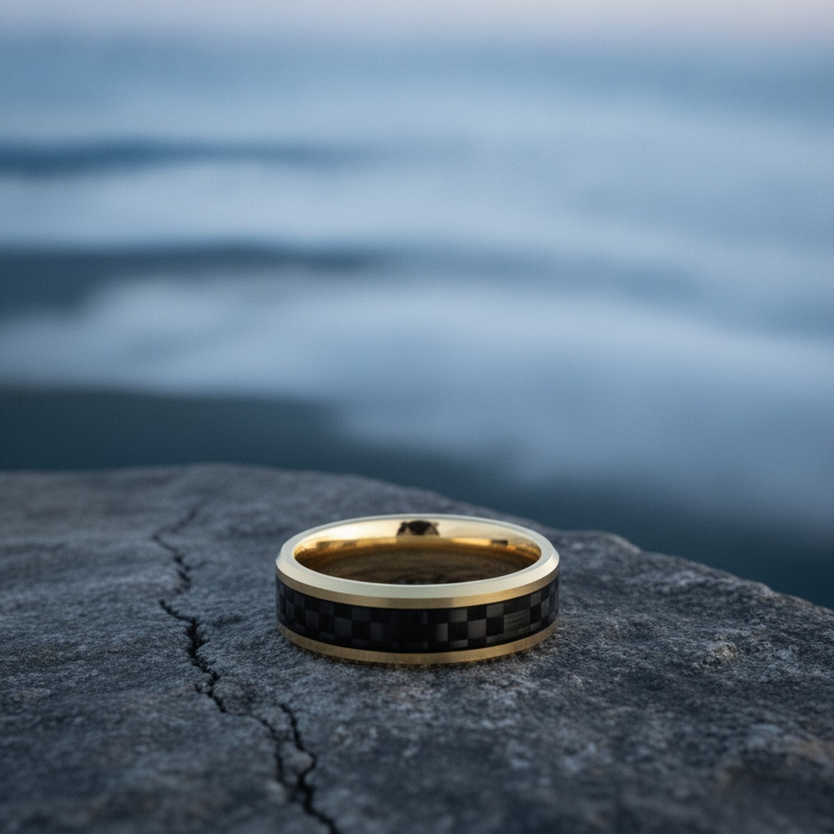 Aydins DECIMUS | Black Carbon Fiber Gold-Plated Tungsten Wedding Band 8mm lifestyle scene, granite overlook