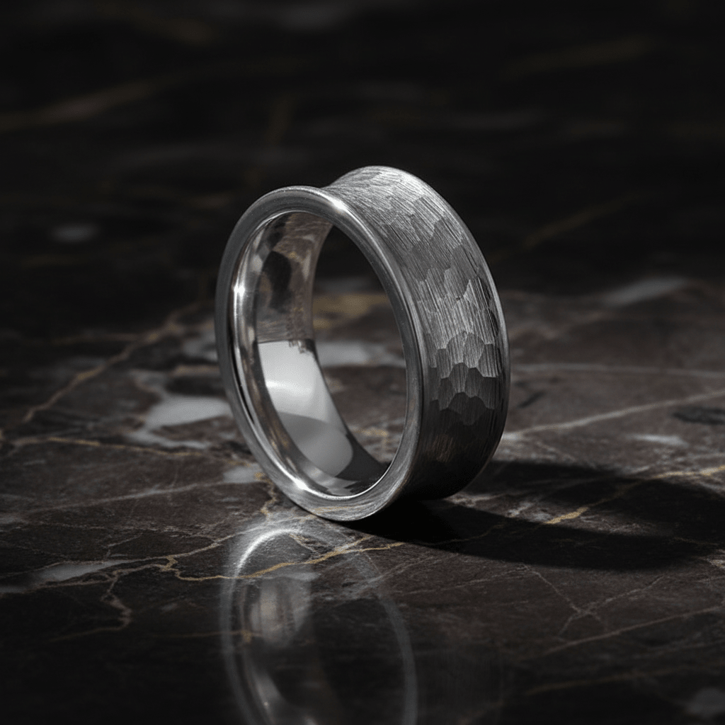 DECIUS — Luxury 3/4 angle on dark marble — men's tungsten wedding ring.