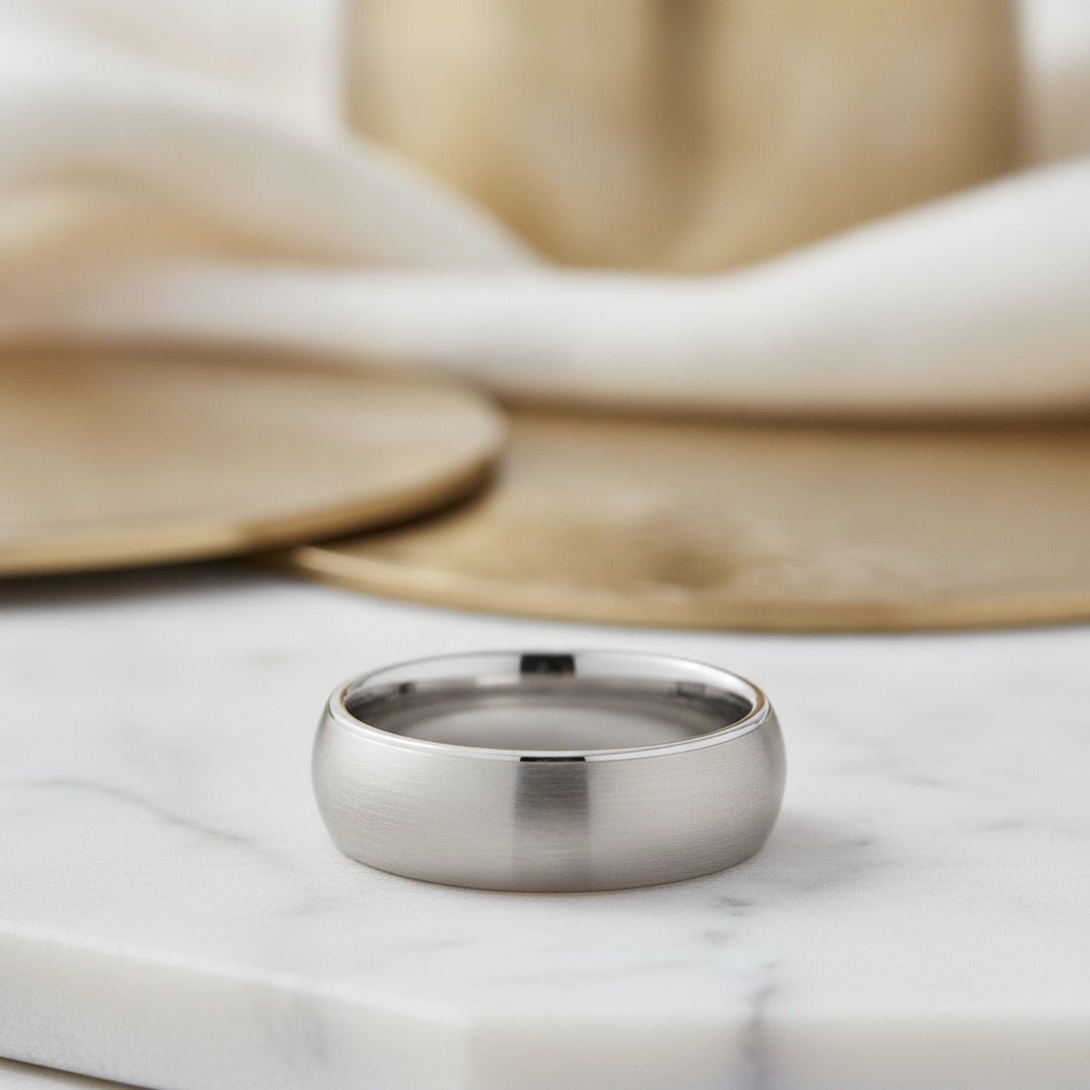 Aydins DEFENDER | Silver Tungsten Domed Ring lifestyle scene, marble minimal