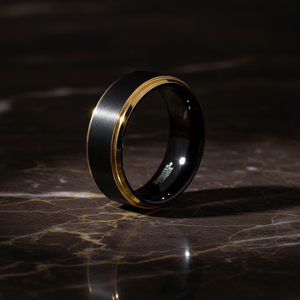 DEIMOS — Luxury 3/4 angle on dark marble — men's tungsten wedding ring.