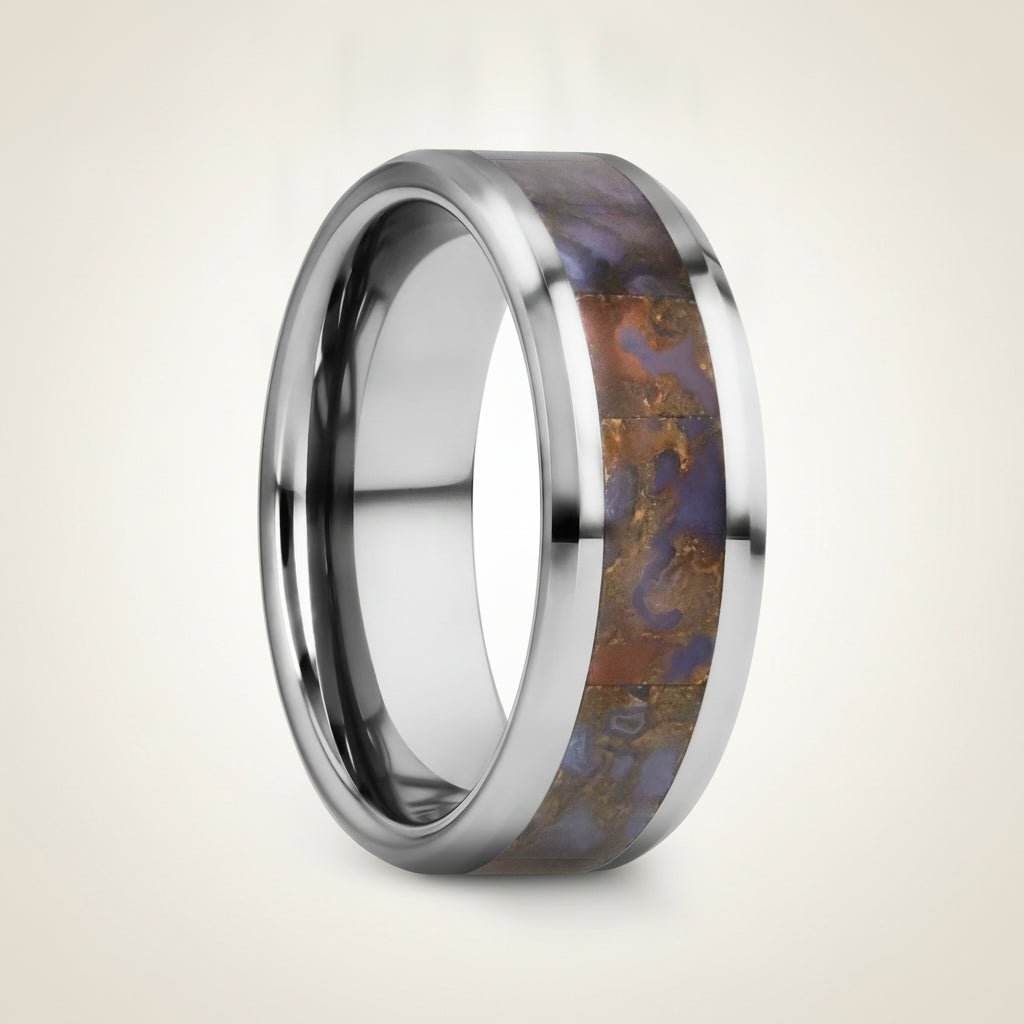 DEVONIAN silver tungsten carbide ring with blue dinosaur bone inlay running around the band and polished beveled edges, studio hero shot