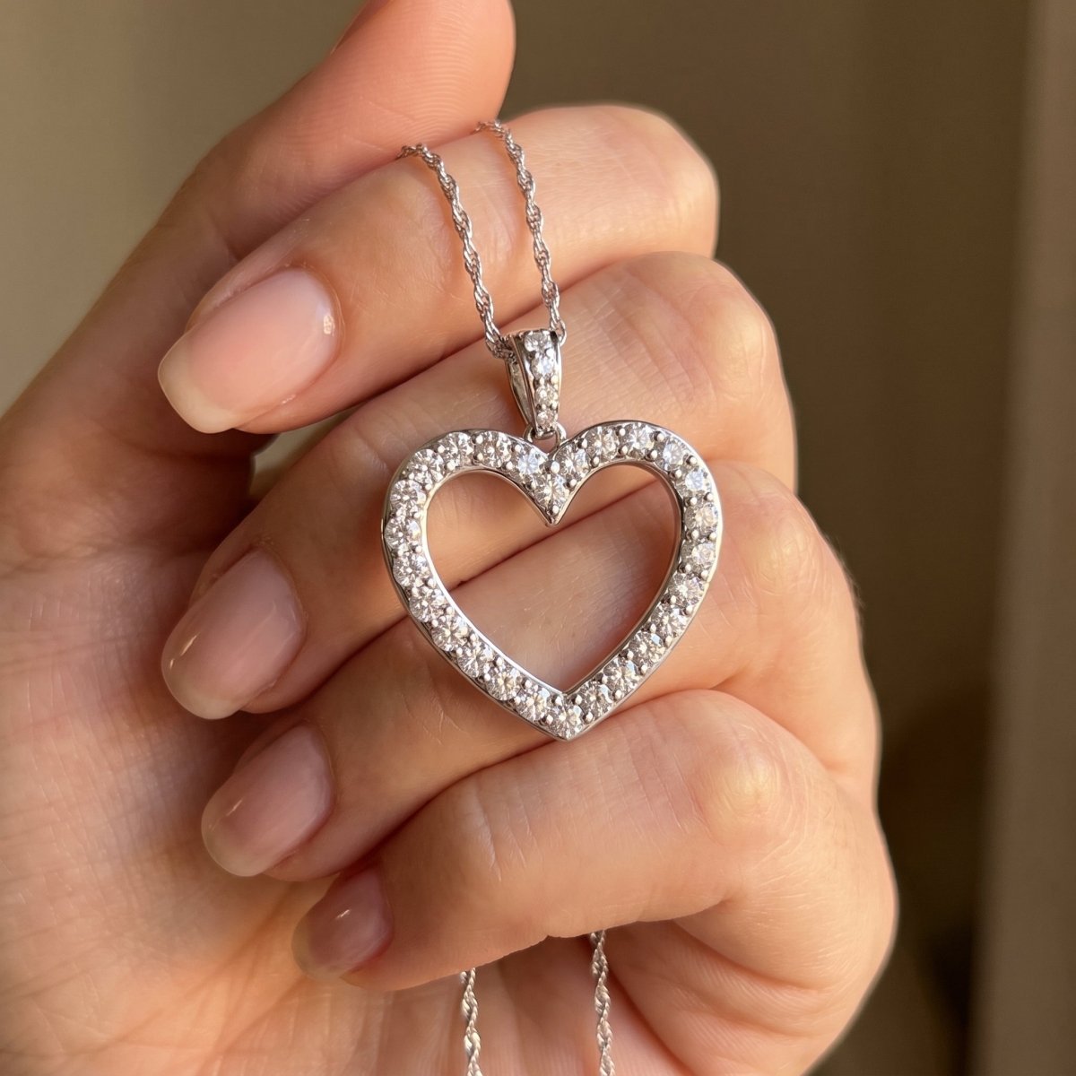 Diamond Heart Pendant With Chain 925 silver lab grown diamond pendant held in hand lifestyle close-up photo