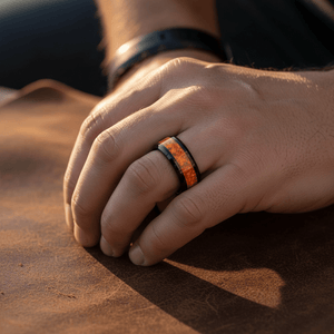 DRAGON — Lifestyle photo on hand — men's tungsten wedding ring.