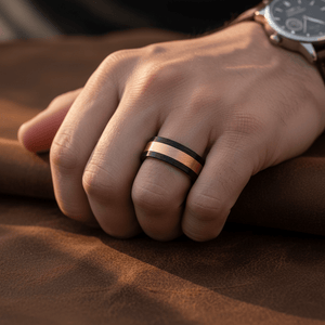 DREAMFLARE — Lifestyle photo on hand — men's tungsten wedding ring.