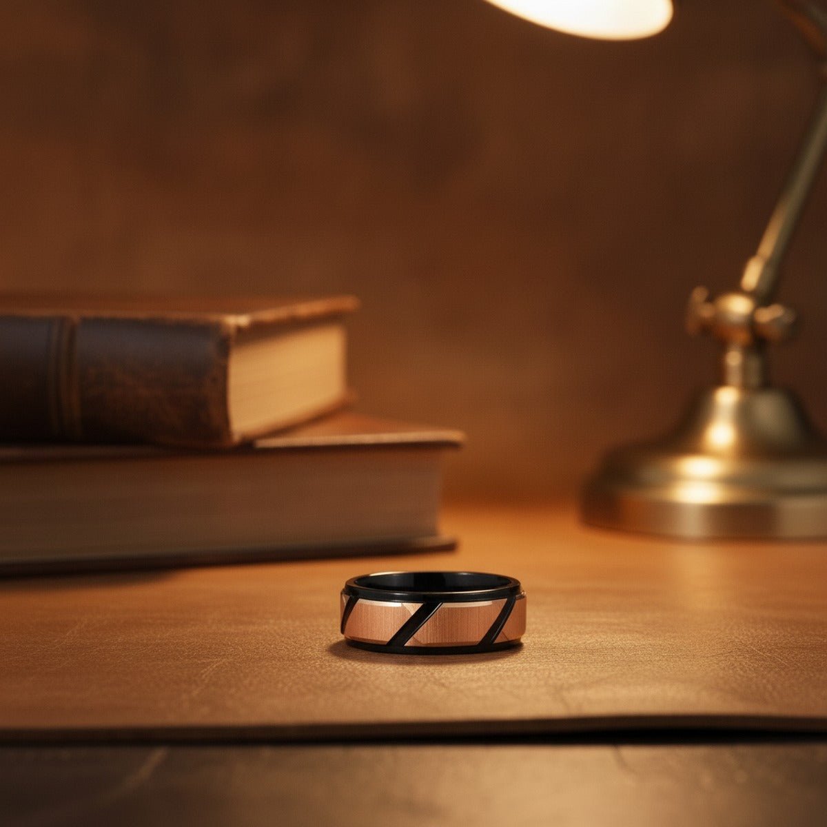 Aydins FISONE | Black Tungsten Rose Gold Ring lifestyle scene, leather library