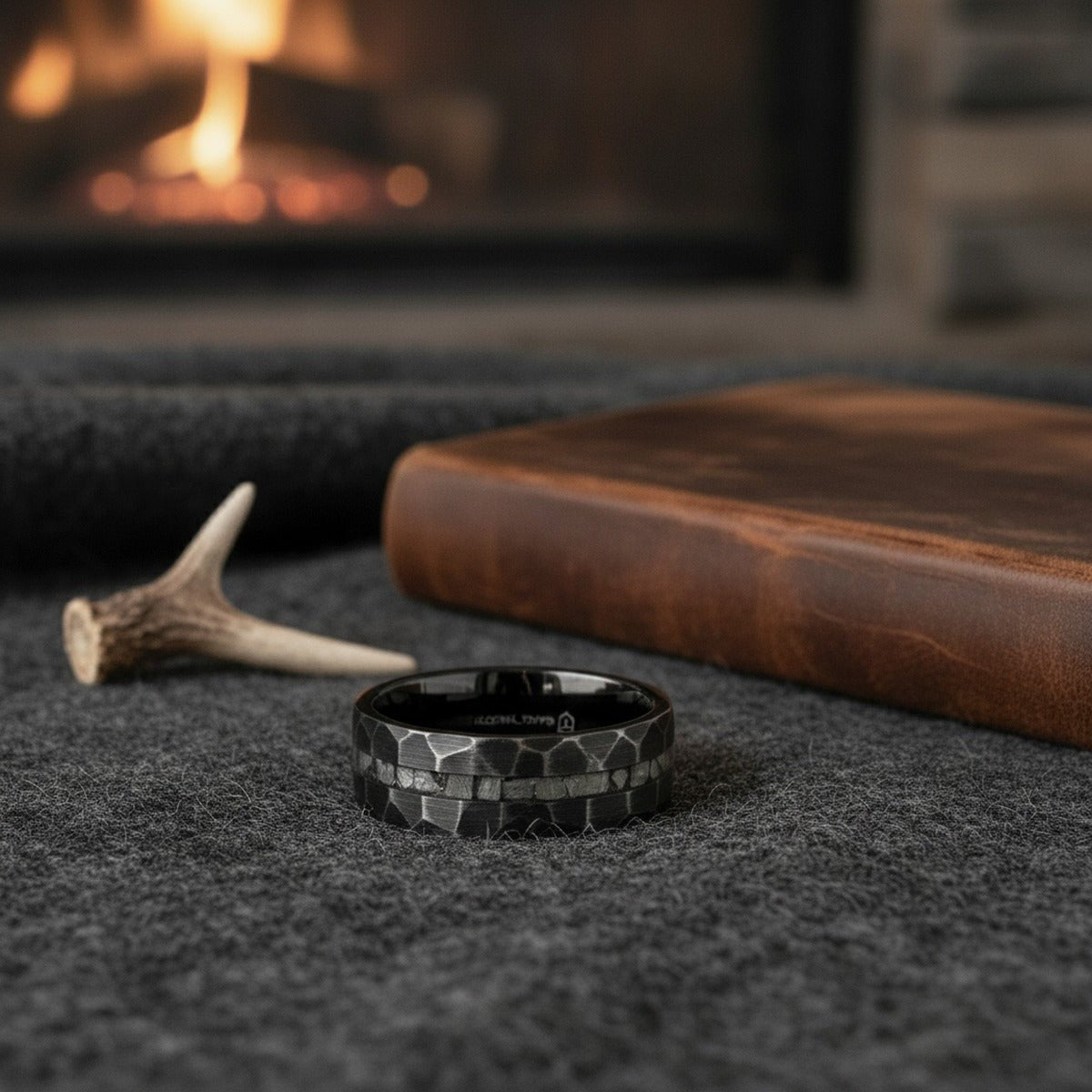 Aydins FISSURE | Black Tungsten Ring, Hammered, Meteorite Inlay lifestyle scene, hunting lodge antler