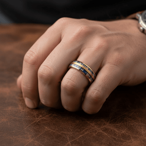 GALLOWAY — Lifestyle photo on hand — men's tungsten wedding ring.