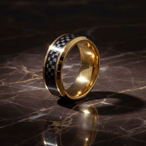 GILDWING — Luxury 3/4 angle on dark marble — men's tungsten wedding ring.