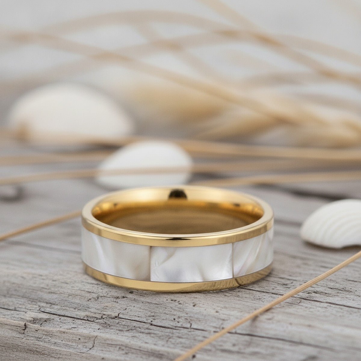 Aydins GRACE | Gold-Plated Tungsten Wedding Band White Abalone Inlay 8mm lifestyle scene, driftwood shells