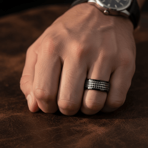 GRAVEL — Lifestyle photo on hand — men's tungsten wedding ring.