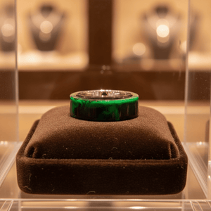 GREENFIRE — Premium boutique display on velvet — men's tungsten wedding ring.