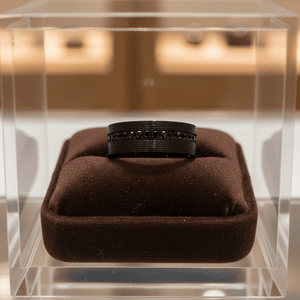 GROOVIX — Premium boutique display on velvet — men's tungsten wedding ring.