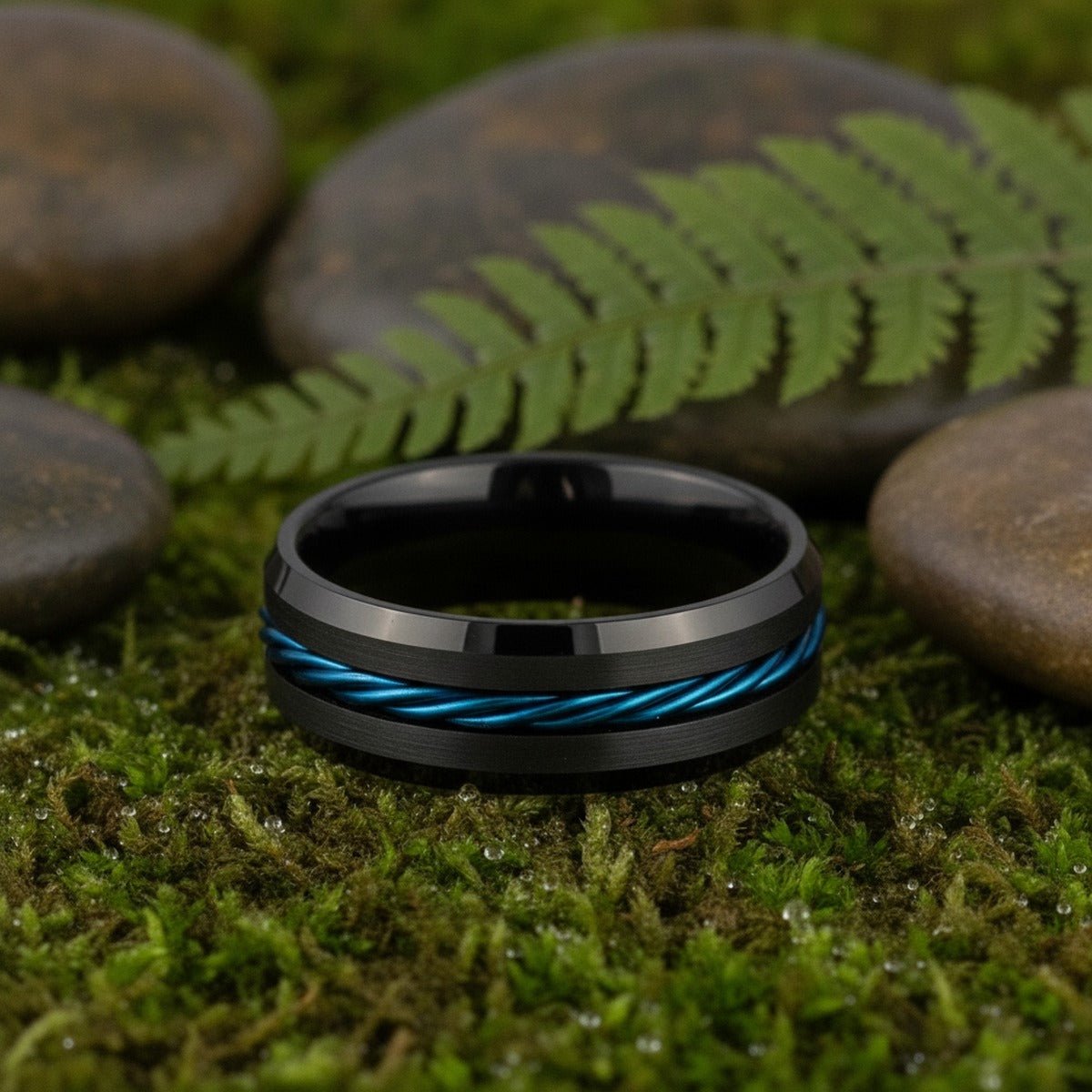 Aydins HAWK | Tungsten Ring Blue Rope Inlay lifestyle scene, moss forest