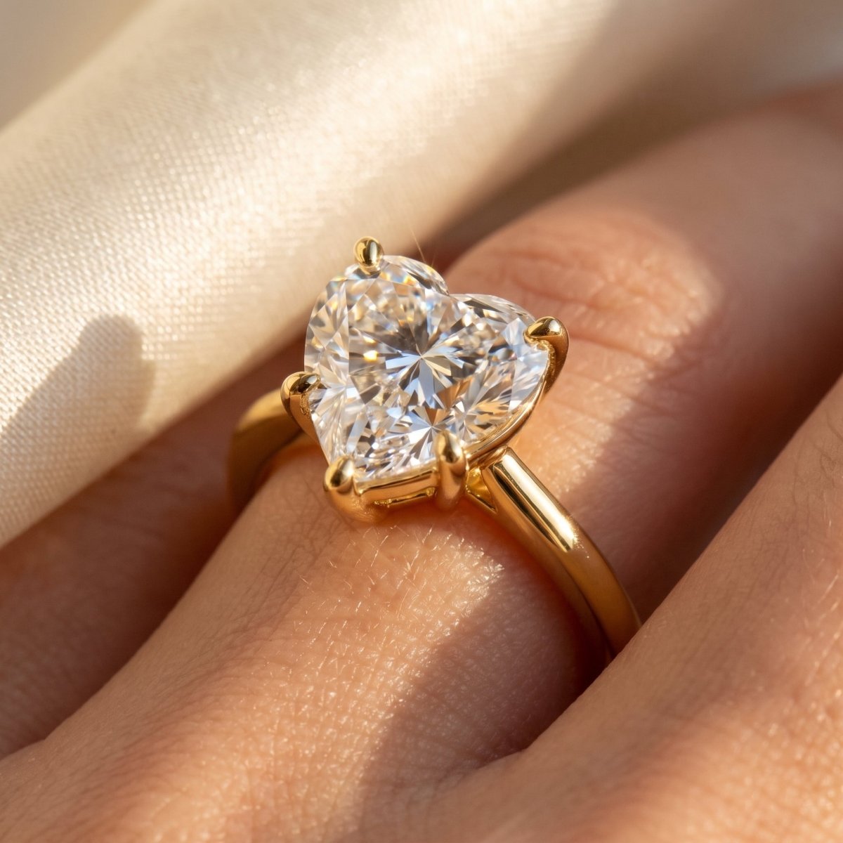 Heart lab-grown diamond solitaire engagement ring, Yellow Gold, on-finger close-up