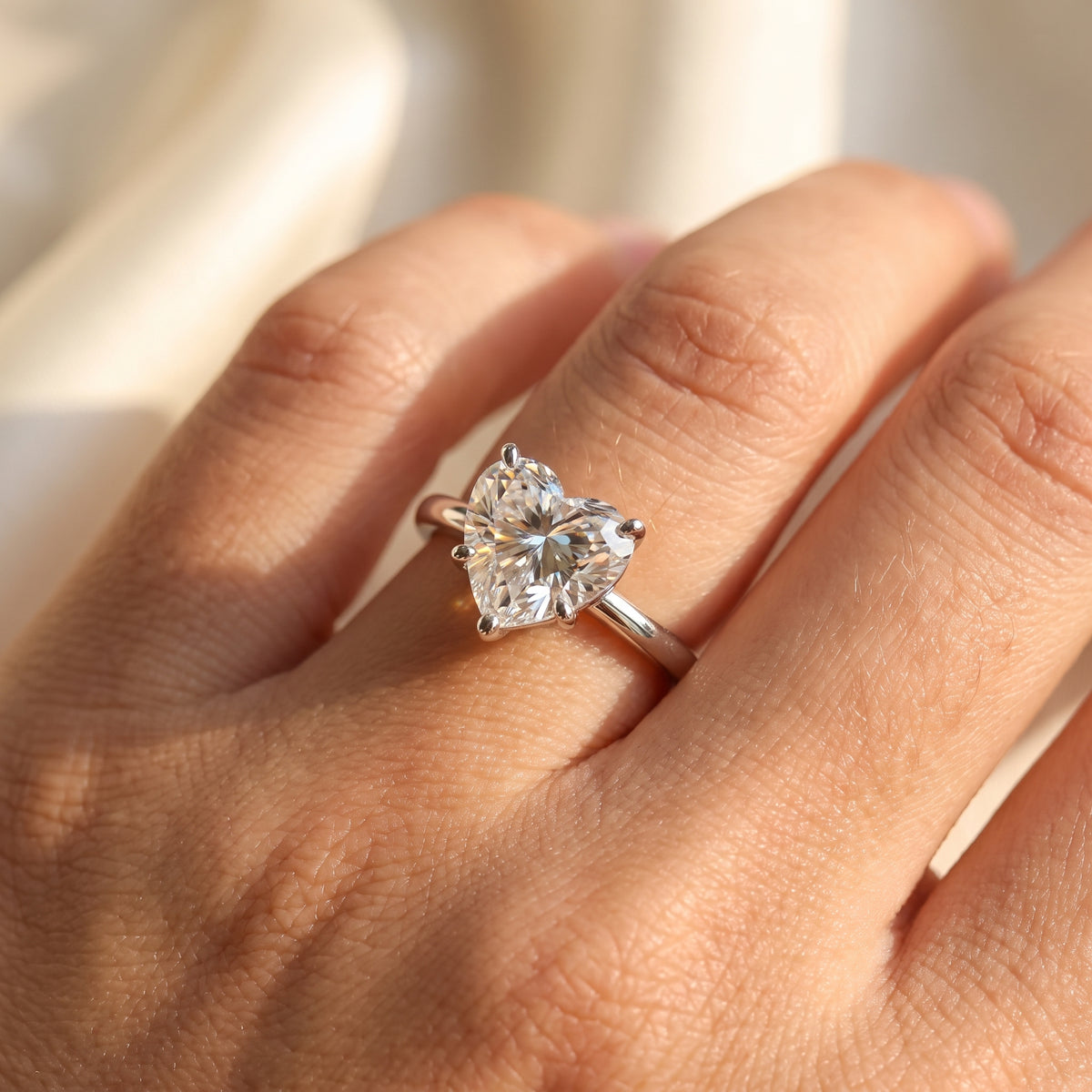 Heart lab-grown diamond solitaire engagement ring, 925 Sterling Silver, on-finger close-up