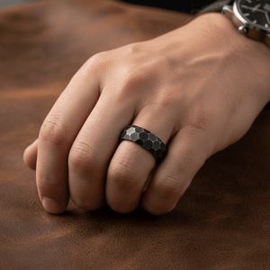 HEXANITE — Lifestyle photo on hand — men's tungsten wedding ring.