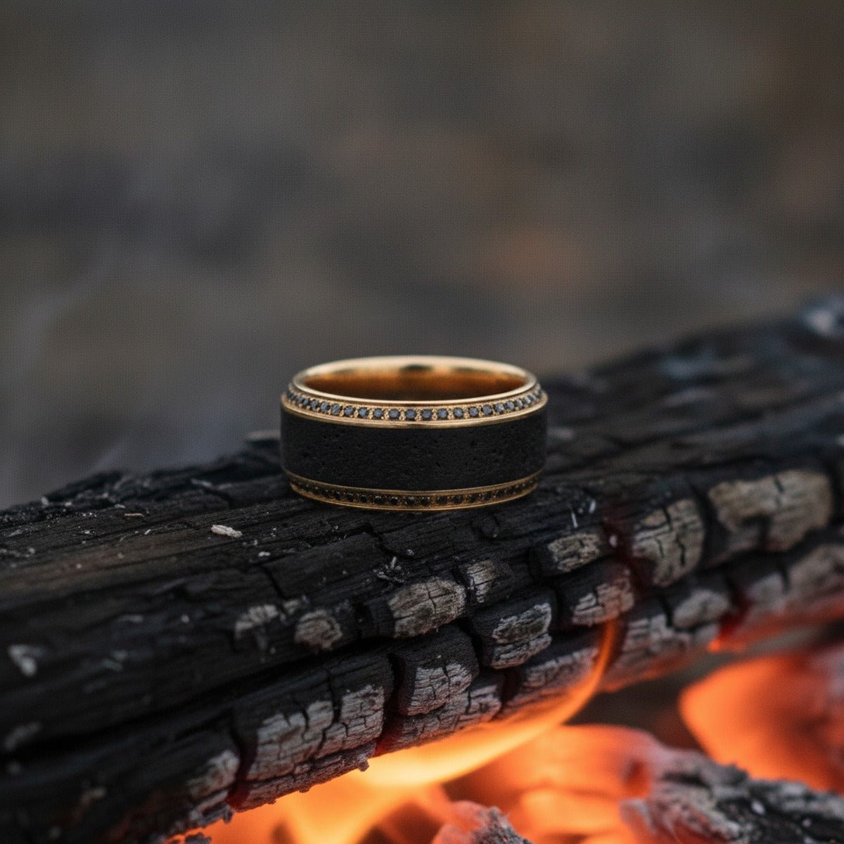Aydins HYPERION | 10K Yellow Gold Wedding Band, Lava Inlay & Black Diamonds lifestyle scene, bonfire embers