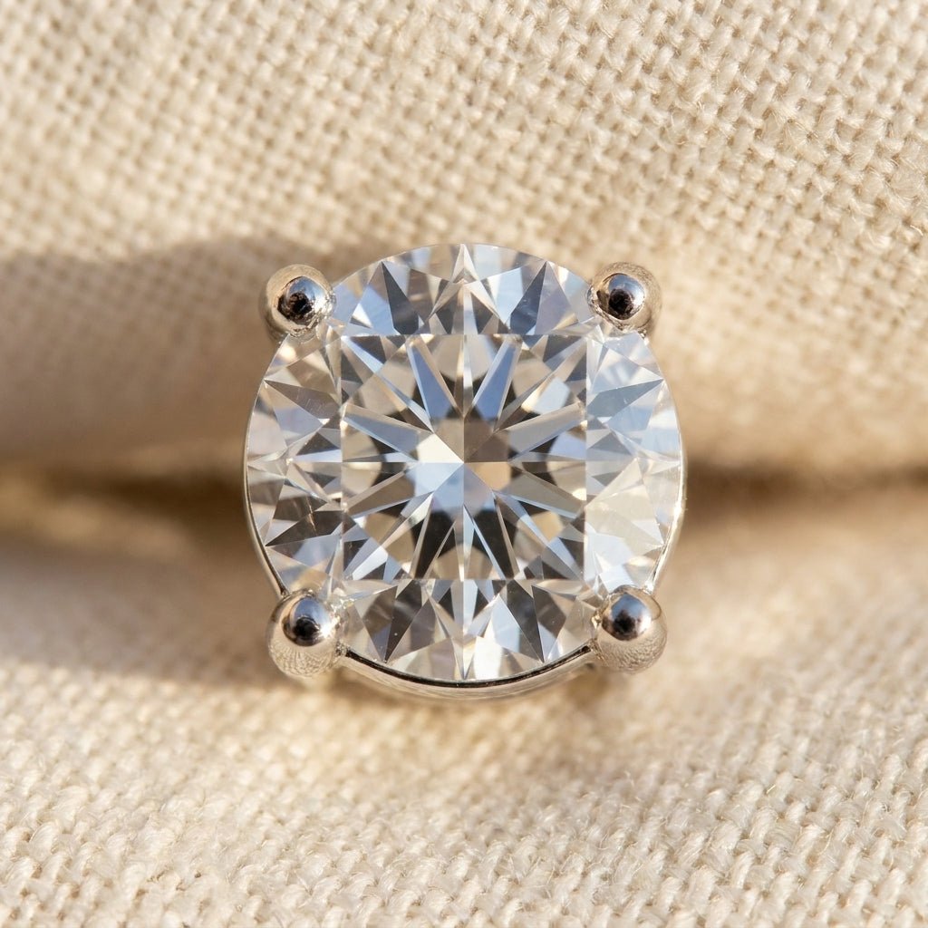 IGI certified lab-grown diamond stud earrings round brilliant, macro detail overhead flat lay