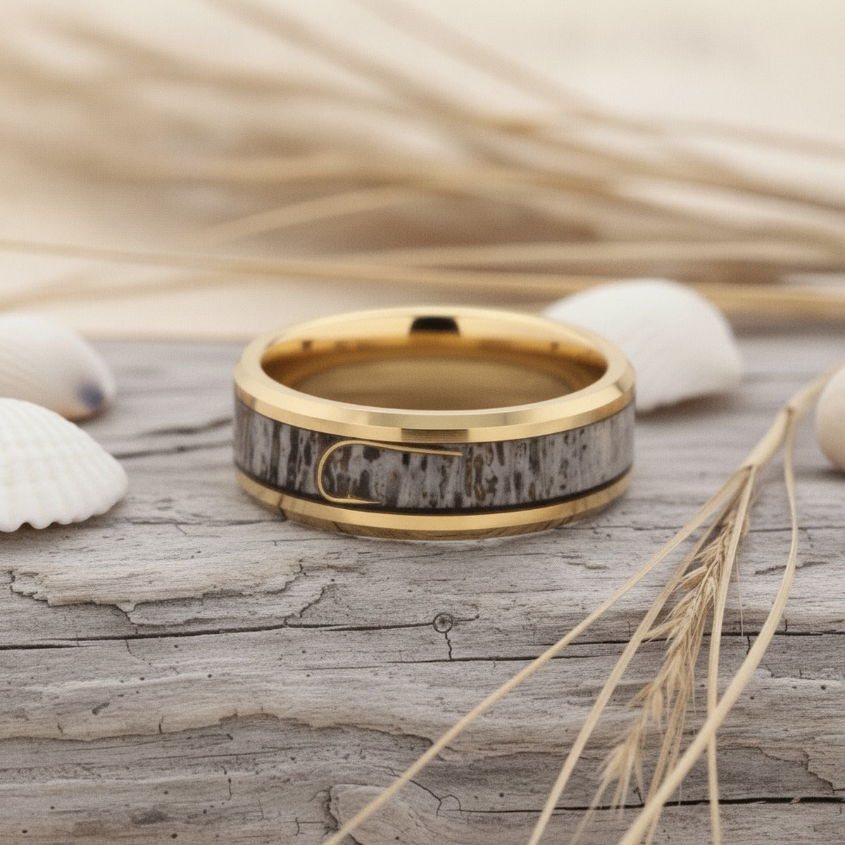 Aydins JAEGER | Gold-Plated Tungsten Wedding Band Deer Antler and Fishhook Inlay 8mm lifestyle scene, driftwood shells