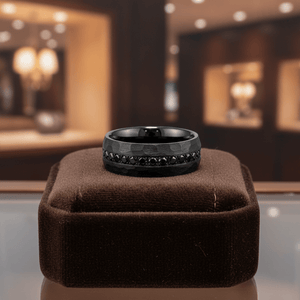 JUNCOS — Premium boutique display on velvet — men's tungsten wedding ring.