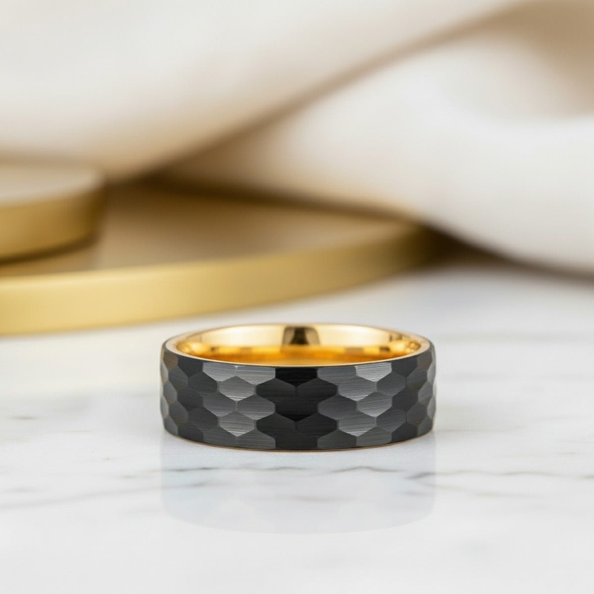 Aydins KNOX | Gold Tungsten Ring with Black Hammered Center lifestyle scene, marble minimal