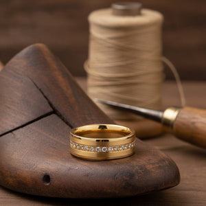 Aydins LEGEND | Gold Tungsten CZ Eternity Wedding Ring 8mm lifestyle scene, cobbler lasts