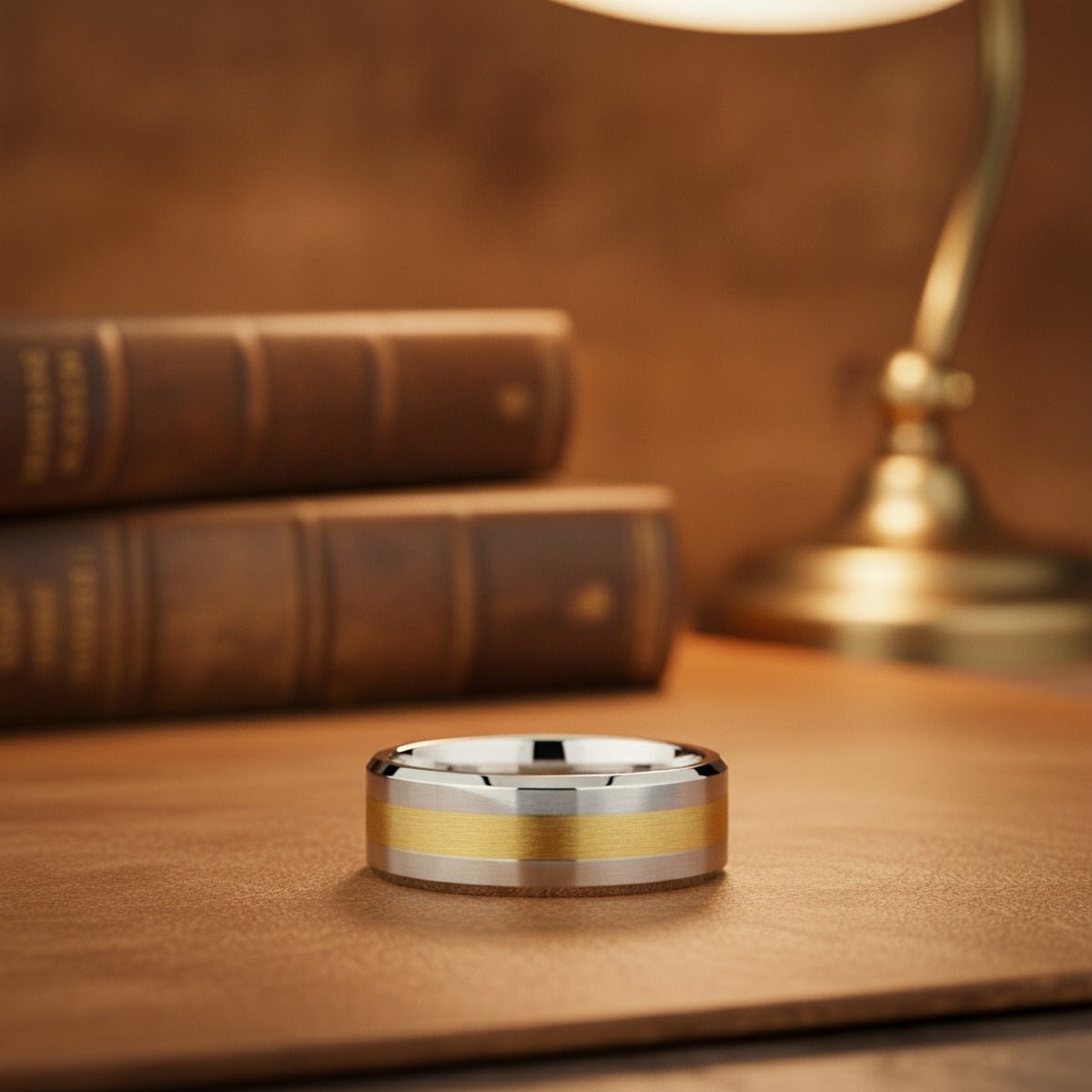 Aydins LEGIONAIRE | Silver Tungsten Ring, 14k Yellow Gold Stripe Inlay, Beveled lifestyle scene, leather library