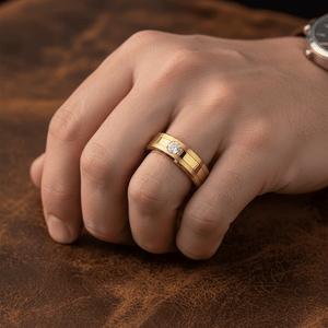 LUMINEX — Lifestyle photo on hand — men's tungsten wedding ring.