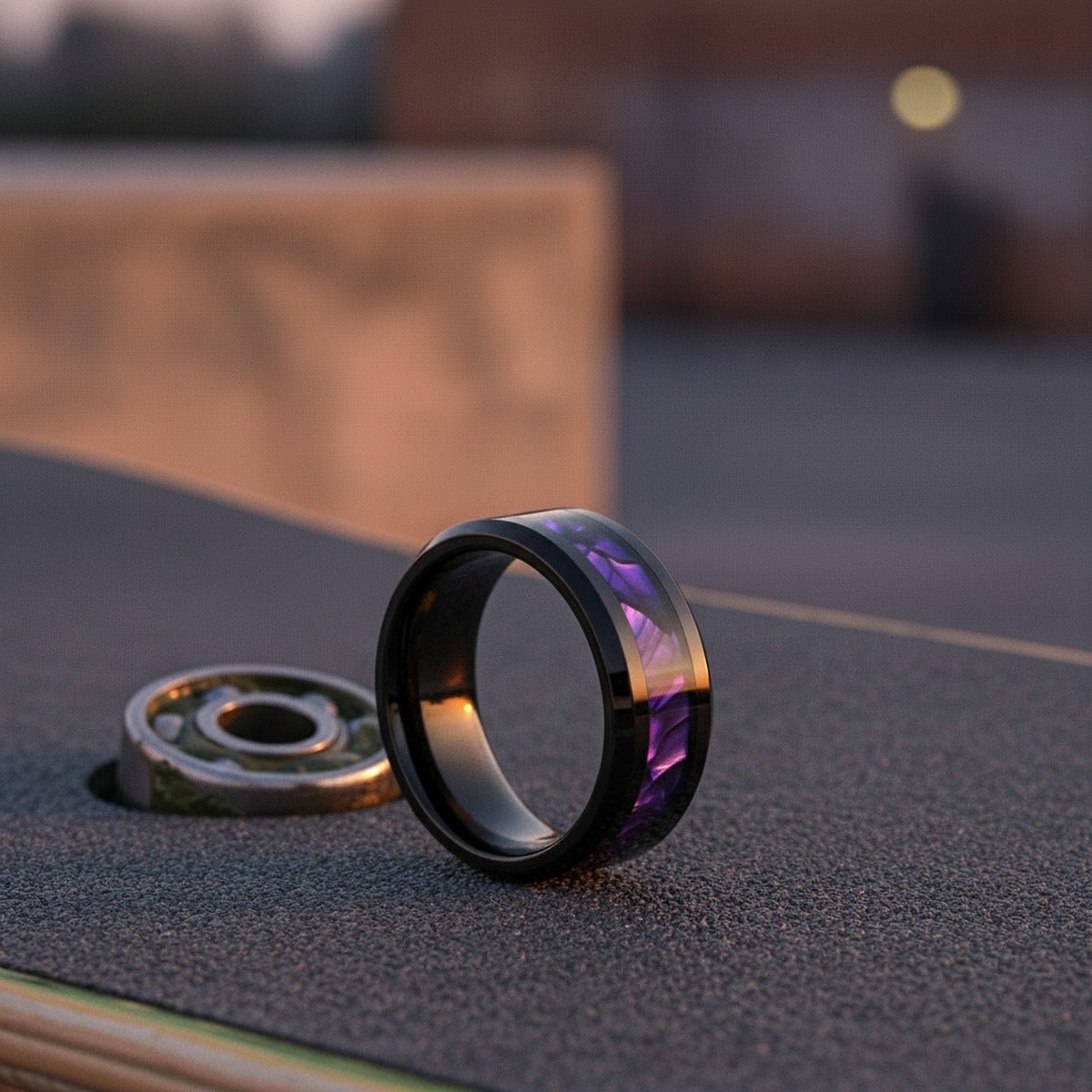 Aydins LUSTERS | Black Tungsten Purple Tiger Cowrie Shell Wedding Ring — 8mm lifestyle scene, skateboard griptape