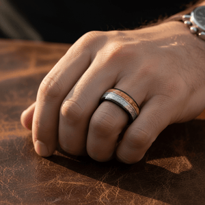 LYRIC — Lifestyle photo on hand — men's tungsten wedding ring.