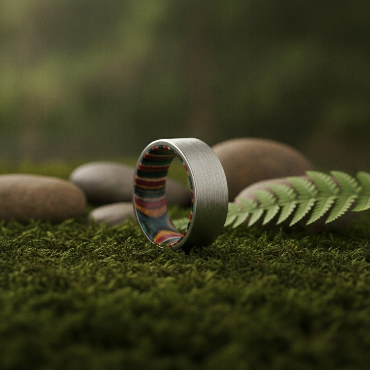 Aydins MAHONEY | Tungsten Multi-Color Wood Inlay Ring 8mm lifestyle scene, moss forest