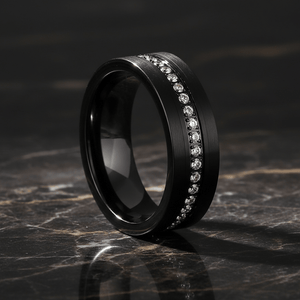 MAJESTIC — Luxury 3/4 angle on dark marble — men's tungsten wedding ring.