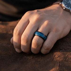 MARCO — Lifestyle photo on hand — men's tungsten wedding ring.