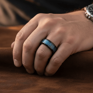 MARIEMONT — Lifestyle photo on hand — men's tungsten wedding ring.