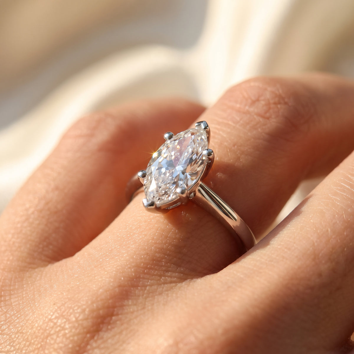 Marquise lab-grown diamond solitaire engagement ring, 925 Sterling Silver, on-finger close-up