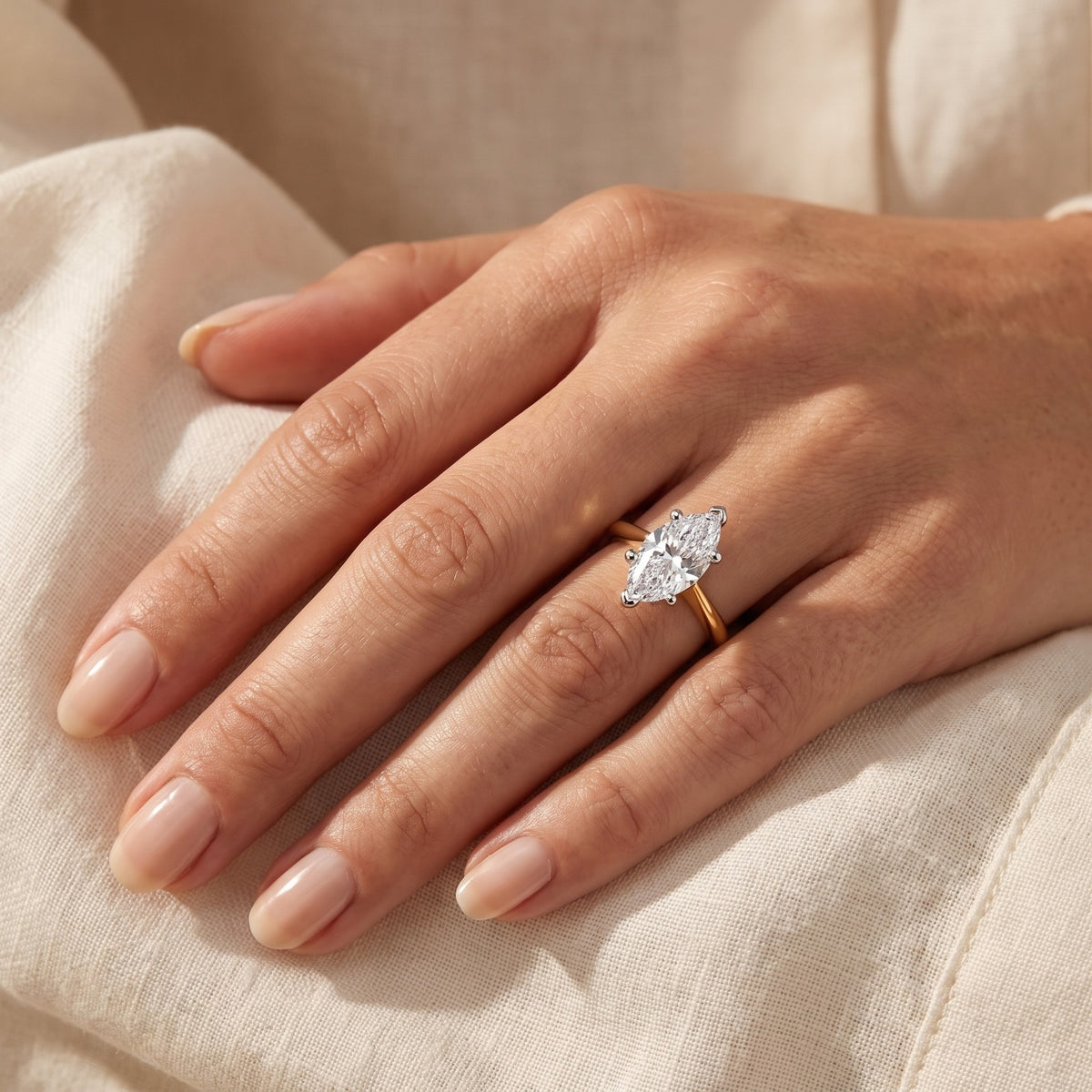 IMOGEN marquise lab-grown diamond ring in 10K two-tone gold, worn on the hand, approx. 1 ct center