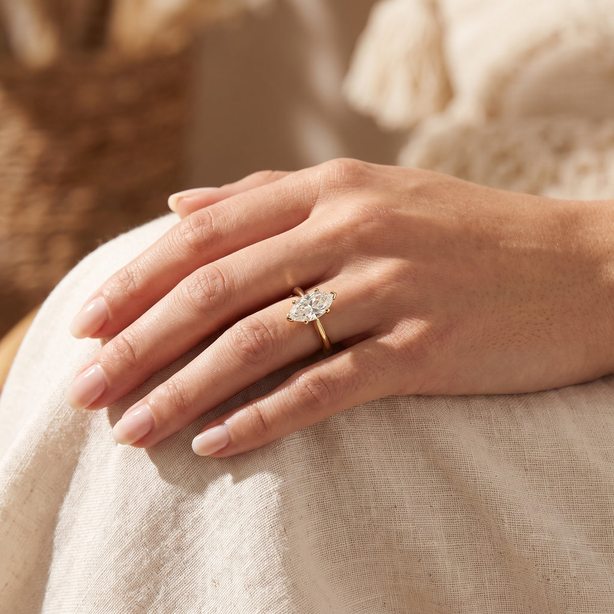 Marquise lab-grown diamond solitaire engagement ring, Yellow Gold, lifestyle photograph