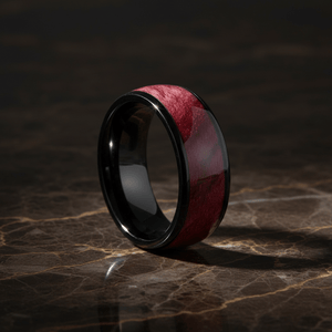 MATHAIOS — Luxury 3/4 angle on dark marble — men's tungsten wedding ring.