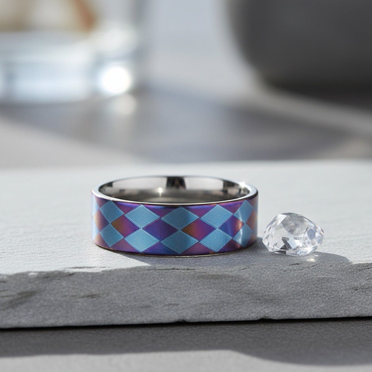 MERIDIAN flat titanium ring on slate stone with crystal, lifestyle scene