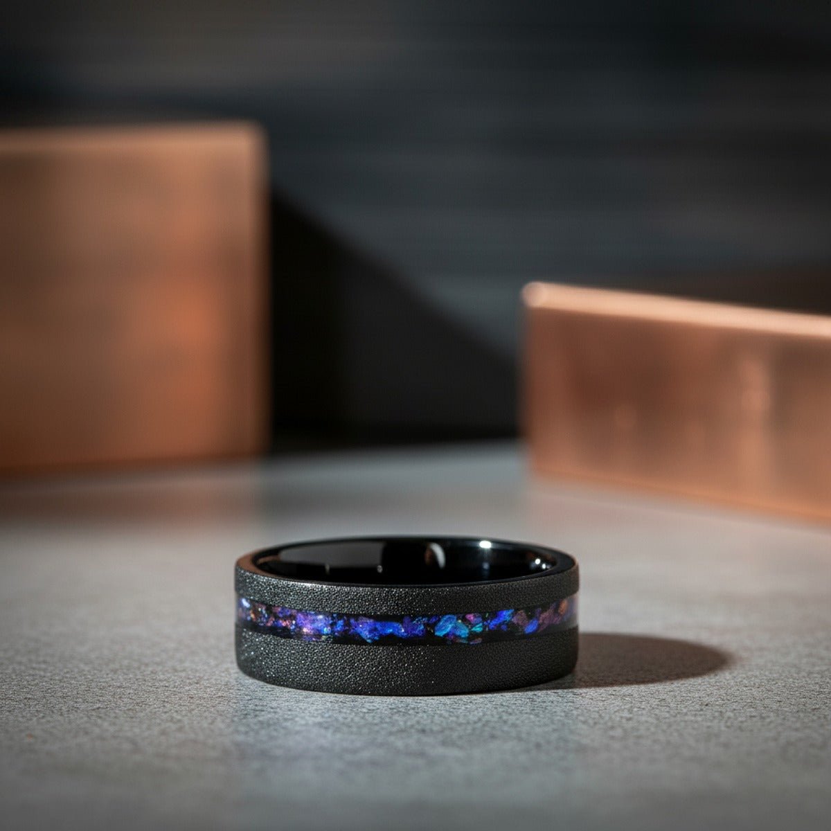 MIRAGE | Black Tungsten Ring, Alexandrite and Goldstone Inlay, Flat lifestyle photography